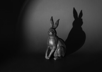 black easter, black rabbit with shadow