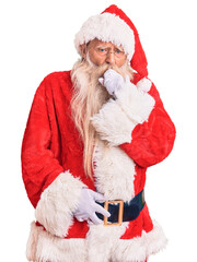Old senior man with grey hair and long beard wearing traditional santa claus costume feeling unwell and coughing as symptom for cold or bronchitis. health care concept.