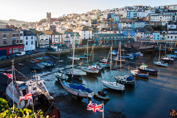 Fototapeta na wymiar Fishing boats in the harbour at Brixham on the south coast of Devon in the Torbay district. Brixham is a small fishing village in the English Riviera, it is a magnet for tourists in the summer.