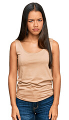 Obraz premium Beautiful hispanic woman wearing casual clothes skeptic and nervous, frowning upset because of problem. negative person.