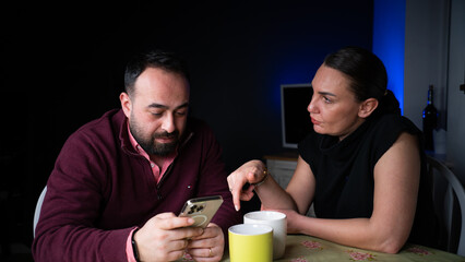Men and women are chatting and laughing among themselves. romantic couple drinking coffee
