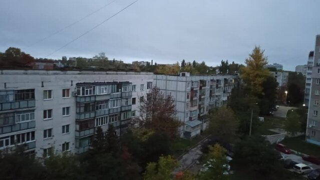 Air raid in night city of Ukraine. Air raid in Ukraine. Siren sounds in evening city during war in Ukraine. Air raid in residential area of the city