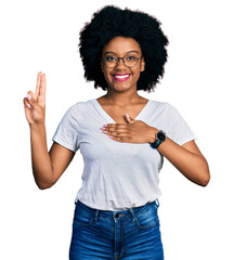 Young african american woman wearing casual white t shirt smiling swearing with hand on chest and...