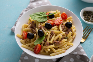 Tuna pasta salad with cherry tomatoes food top view