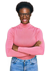 Young african american girl wearing casual clothes and glasses happy face smiling with crossed arms...