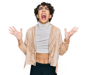 Handsome man wearing make up and woman clothes crazy and mad shouting and yelling with aggressive expression and arms raised. frustration concept.