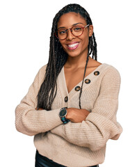 African american woman wearing casual clothes happy face smiling with crossed arms looking at the...