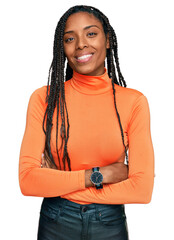 African american woman wearing casual clothes happy face smiling with crossed arms looking at the...