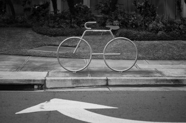 Fototapeta na wymiar Bicycle Only Parking Stand on a Sidewalk in Black and White. 