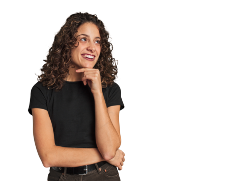 Radiant young woman with stunning curls looking sideways with doubtful and skeptical expression.