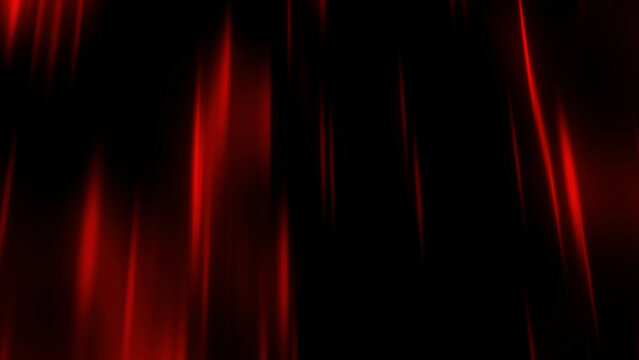 Dark background. Motion. Thin beams of red in the animation scatter slowly in different directions through the darkness.