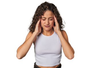 Radiant young woman with stunning curls touching temples and having headache.