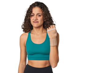 Injury won't stop her! This determined athlete wears a wrist brace and stays focused on her recovery.