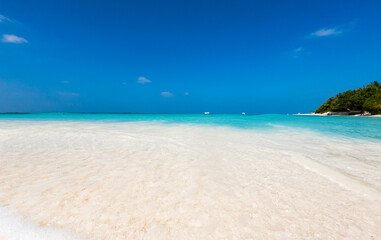 Fototapeta na wymiar amazing tropical beach background white sand and clear blue water