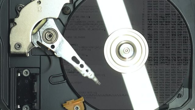 Top view to the hard drive disk with recovery data after hacker attack. Fix problem with computer hdd at the pc repair service. Crypting and decrypting private and confidential digital information.