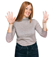 Young irish woman wearing casual clothes showing and pointing up with fingers number nine while...