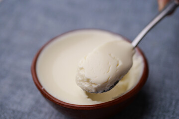 fresh yogurt in a bowl on table 