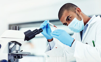 I perform miracles on a daily basis. Cropped shot of a young male scientist working in his lab.