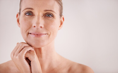 Facing age with a carefree attitude. Cropped portrait of a beautiful mature woman posing in studio.
