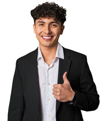 A young latin business man in suit smiling and raising thumb up