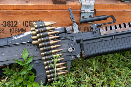 American M60 machine gun with ammunition box and ammunition belt