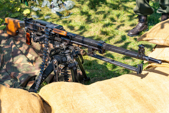 Soviet nsv heavy machine gun with sandbags and camouflage net