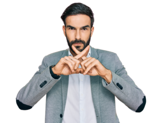 Young hispanic man wearing business clothes rejection expression crossing fingers doing negative sign