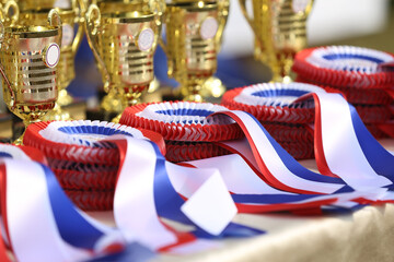 Pile of horse sport trophies rosettes at equestrian event