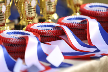 Pile of horse sport trophies rosettes at equestrian event