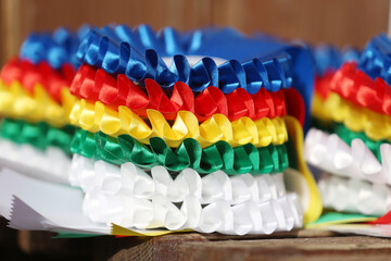 Pile of horse sport trophies rosettes at equestrian event