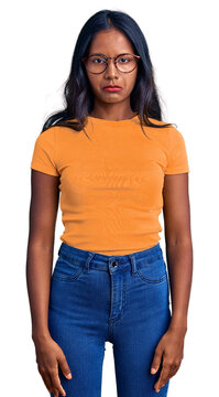 Young indian girl wearing casual clothes and glasses depressed and worry for distress, crying angry and afraid. sad expression.