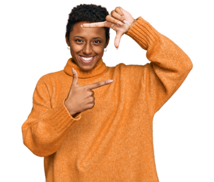 Young african american woman wearing casual clothes smiling making frame with hands and fingers with happy face. creativity and photography concept.