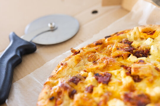 Close up of countertop in kitchen with pizza in box