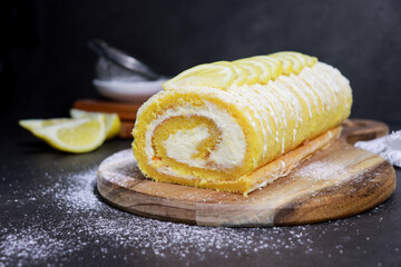 close up of vanilla cake roll with lemon butter cream inside