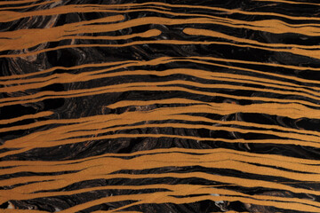 Art flow pour wave oil and acrylic color painting line blot wall. Abstract swirl black and gold texture background.