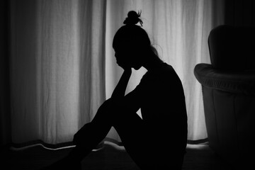 female woman at home suffering from depression, sadness, divorce, loneliness.	