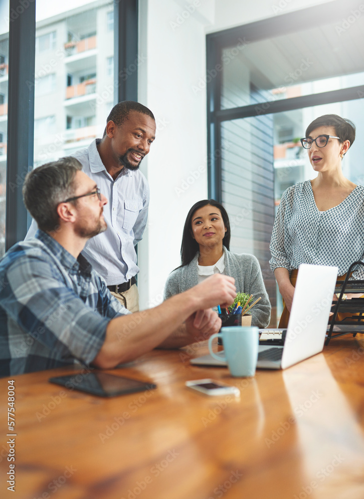 Poster working together to get the task done. shot of businesspeople working together in the office.