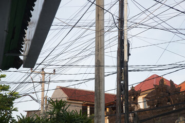 Messy unorganized electrical wires on the street of Indonesia