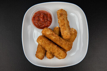 Crispy Halloumi cheese sticks Fries with Chili sauce for dipping.