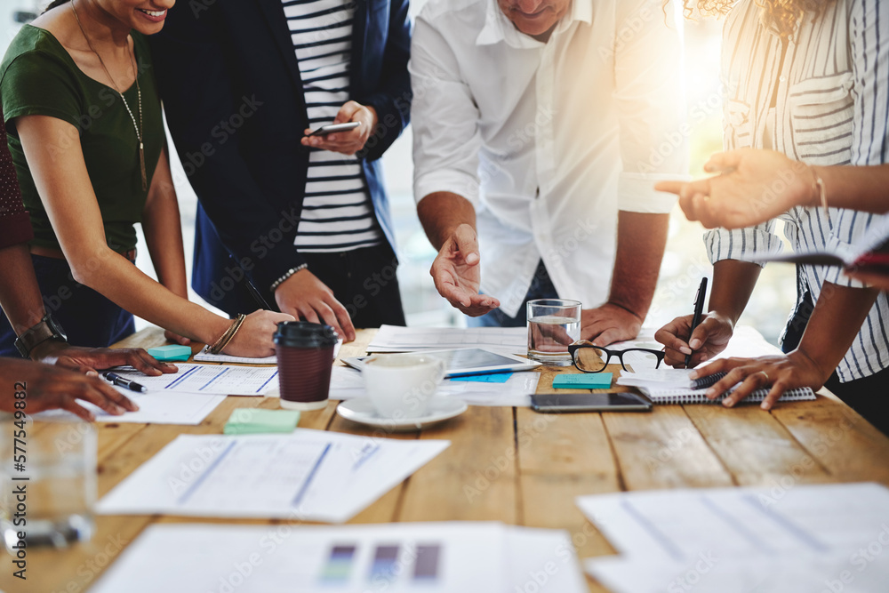 Poster we apply creativity to get the job done. shot of a group of unrecognizable people working together i
