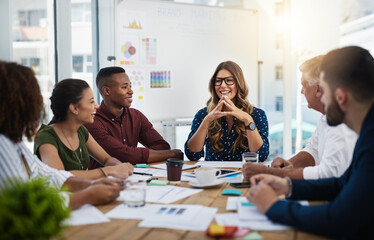 Alone we can think, together we can create. Shot of creative employees working in a modern office.