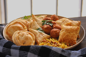 Snack platter including samoosas, pies meatballs and crackles