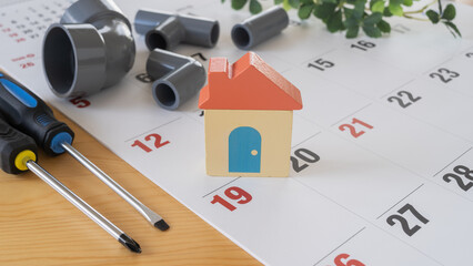 カレンダーと塩ビ管と工具｜住宅設備修理　スケジュール　イメージ