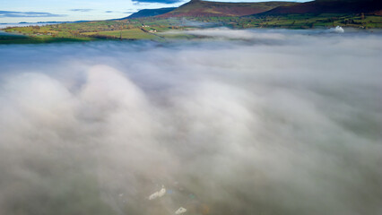 Aerial view of low lying fog above farmers fields