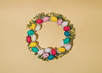 Easter wreath on a pastel background. Minimal easter holiday concept.