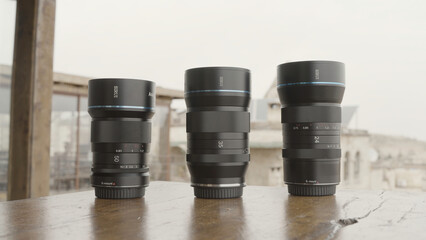 Professional equipment for shooting. Action. Camera lenses taken in nature, and the camera itself for shooting landscapes and portraits