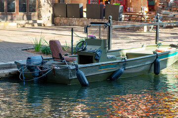 Green boat on river front or canals in san antonio texas for police and authorities and tourism in restaurant sector