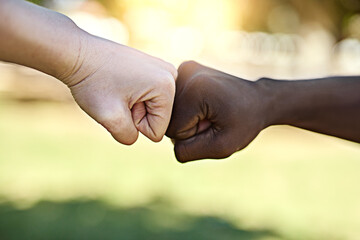 Ill always have your back. Cropped shot of two unrecognisable people fist bumping each other.