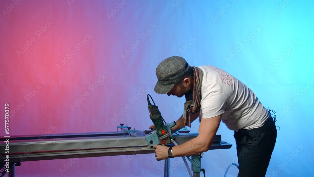 Poster man works at modern carpentry table. creative. modern carpentry table with fixing fasteners and cutt