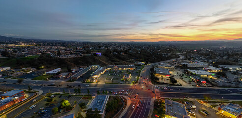 An Aerial View of the Sun Going Down over Yucaipa, California, with a Super market Shopping Complex...